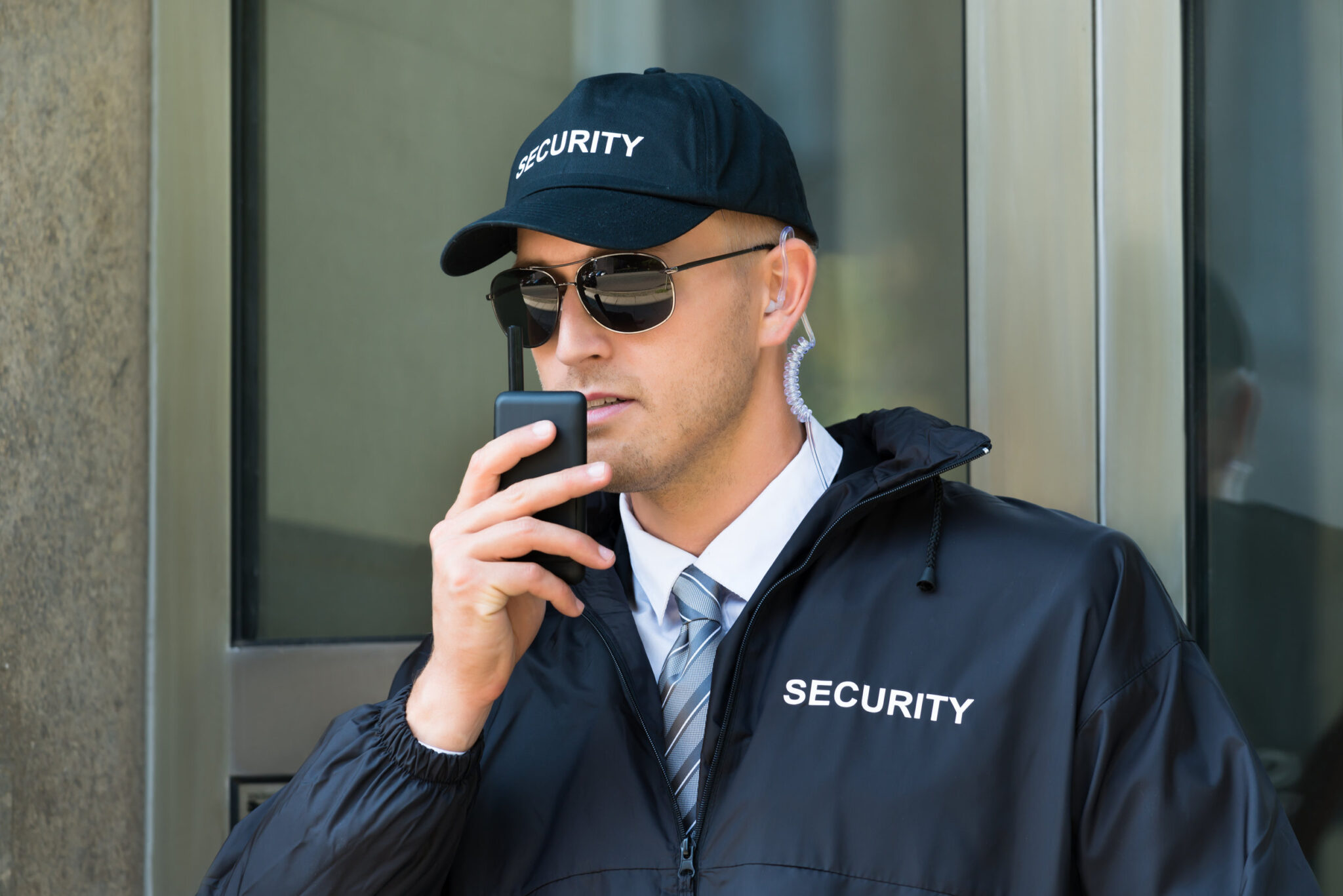 Blog 8 Portrait Of Young Security Guard Using Walkie-talkie Radio